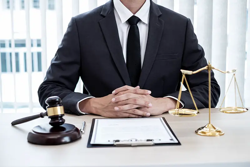 A Cush Insurance claims advisor at their desk, ready to help